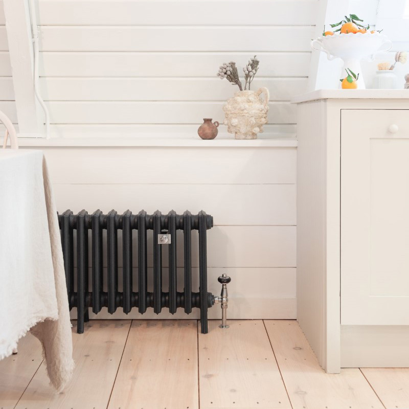 A Grace cast iron radiator in Farrow and Ball's 'Black Blue'